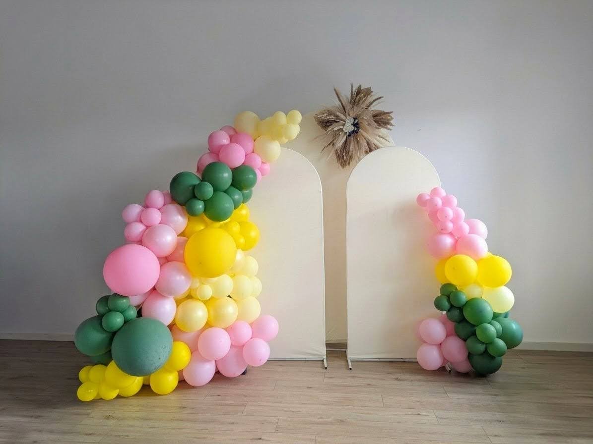 Pink yellow and green organic balloon garland with double arch backdrop for birthday NJ